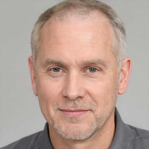 Neutral white middle-aged male with short  gray hair and brown eyes