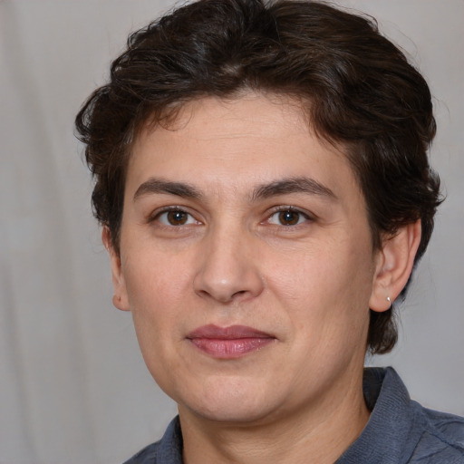 Joyful white young-adult male with medium  brown hair and brown eyes