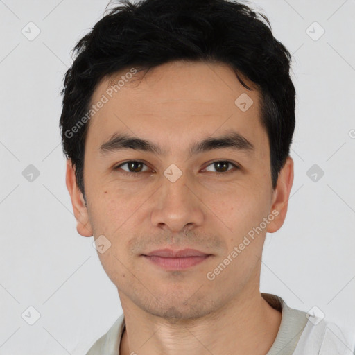 Joyful asian young-adult male with short  black hair and brown eyes