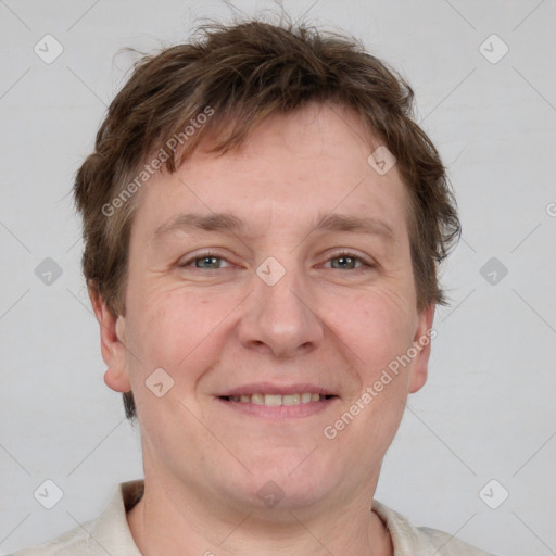 Joyful white adult male with short  brown hair and grey eyes