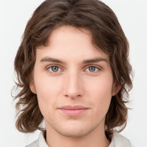 Neutral white young-adult male with medium  brown hair and green eyes