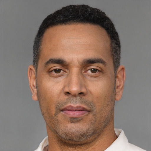 Neutral latino adult male with short  black hair and brown eyes