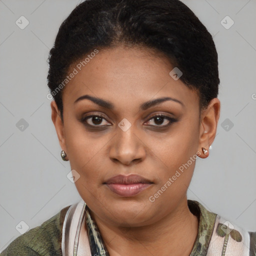 Joyful black young-adult female with short  black hair and brown eyes