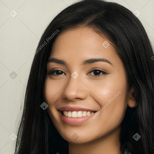 Joyful latino young-adult female with long  brown hair and brown eyes