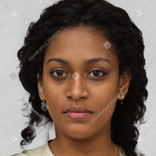 Joyful black young-adult female with long  black hair and brown eyes