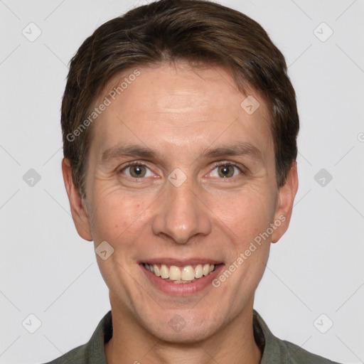 Joyful white adult male with short  brown hair and grey eyes