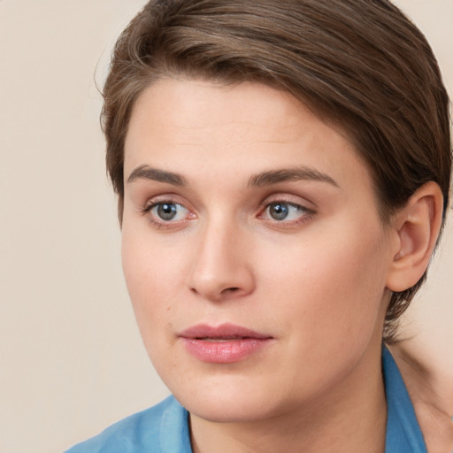 Neutral white young-adult female with short  brown hair and grey eyes