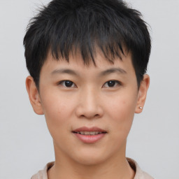 Joyful asian young-adult female with short  brown hair and brown eyes