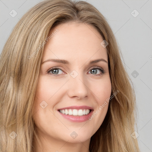 Joyful white young-adult female with long  brown hair and brown eyes