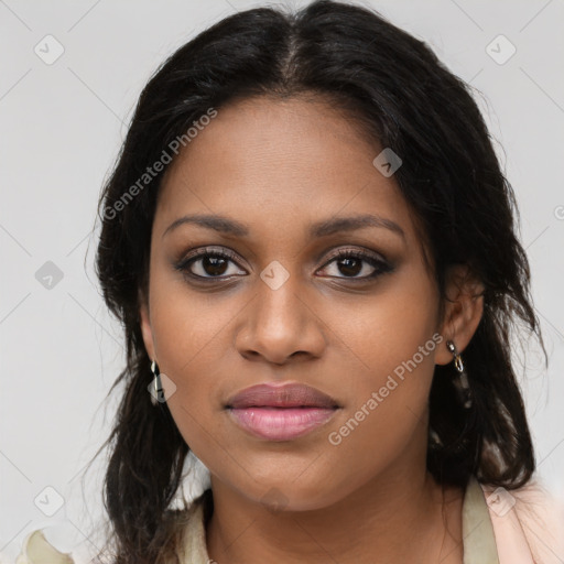Joyful black young-adult female with long  brown hair and brown eyes
