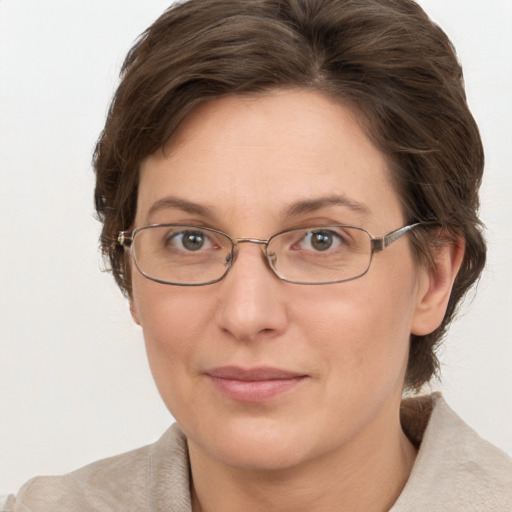 Joyful white adult female with short  brown hair and brown eyes