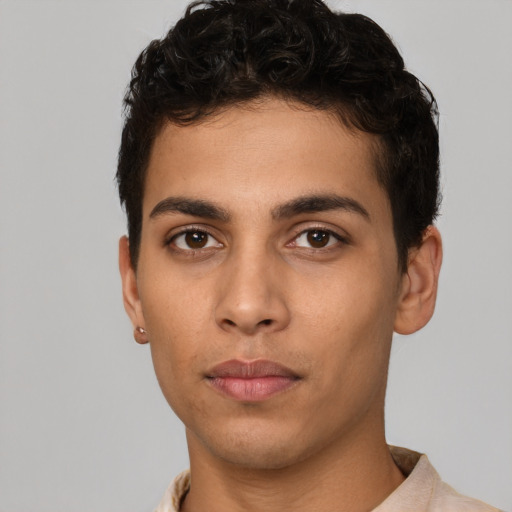Neutral white young-adult male with short  black hair and brown eyes