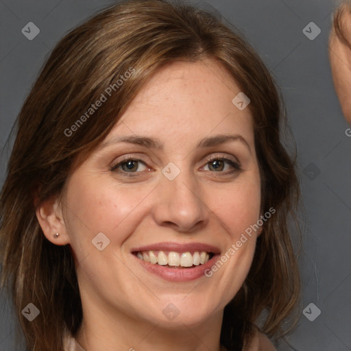 Joyful white adult female with medium  brown hair and grey eyes