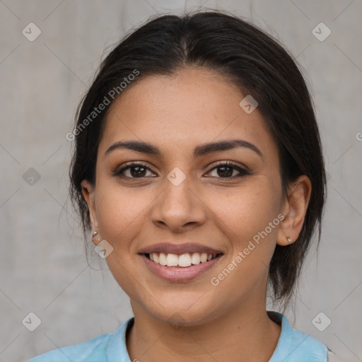 Joyful latino young-adult female with medium  brown hair and brown eyes