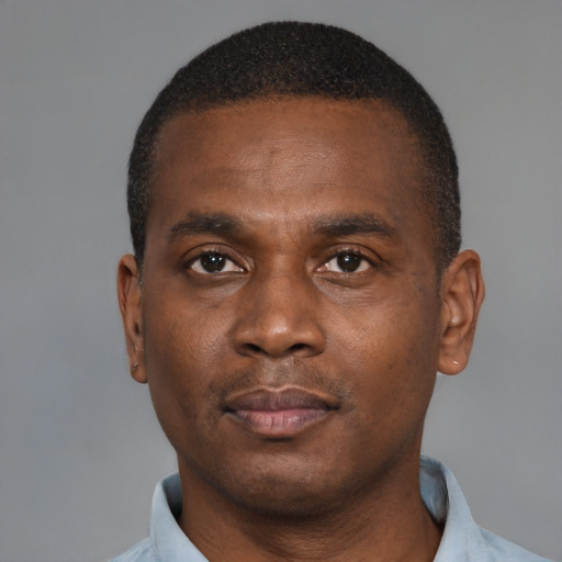 Neutral black young-adult male with short  black hair and brown eyes
