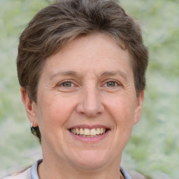 Joyful white adult female with short  brown hair and grey eyes