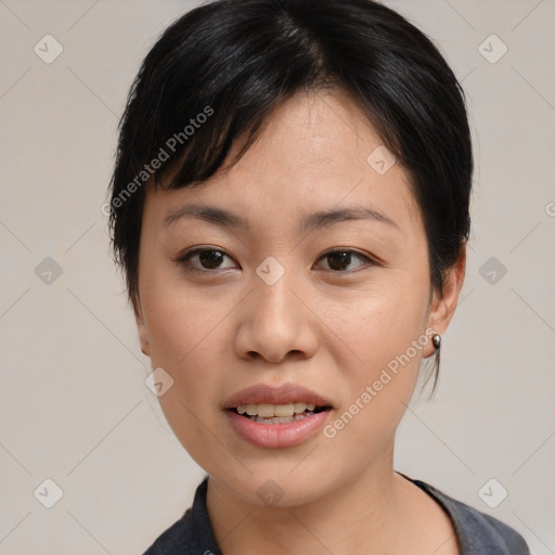 Joyful asian young-adult female with medium  black hair and brown eyes