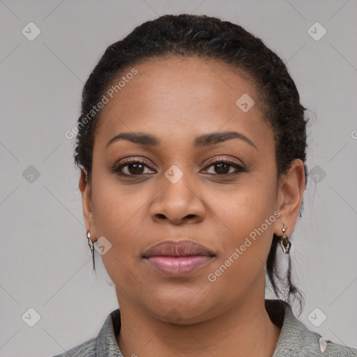 Joyful black young-adult female with medium  black hair and brown eyes