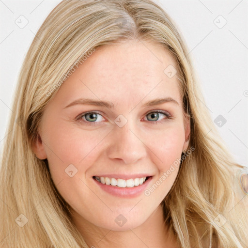 Joyful white young-adult female with long  brown hair and blue eyes