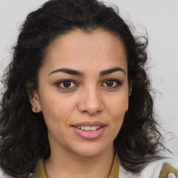 Joyful latino young-adult female with long  brown hair and brown eyes