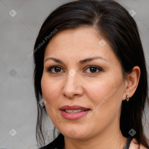 Joyful white adult female with medium  brown hair and brown eyes