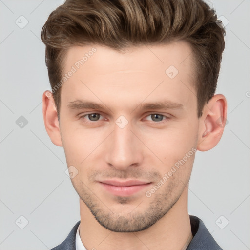 Joyful white young-adult male with short  brown hair and grey eyes