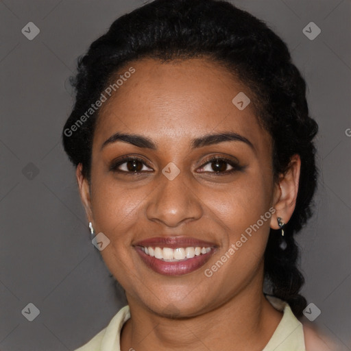 Joyful black young-adult female with short  black hair and brown eyes