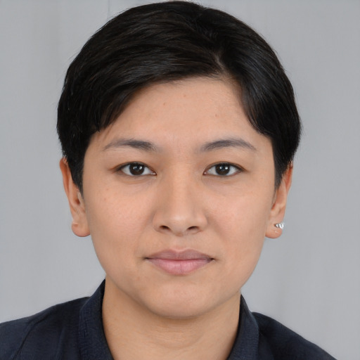 Joyful white young-adult female with short  black hair and brown eyes