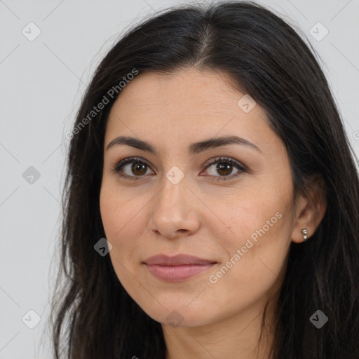 Joyful latino young-adult female with long  brown hair and brown eyes