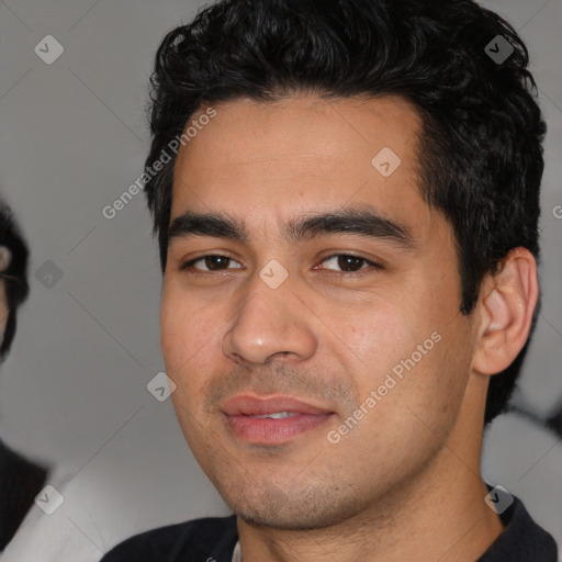 Joyful white young-adult male with short  black hair and brown eyes