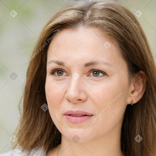 Joyful white adult female with long  brown hair and brown eyes