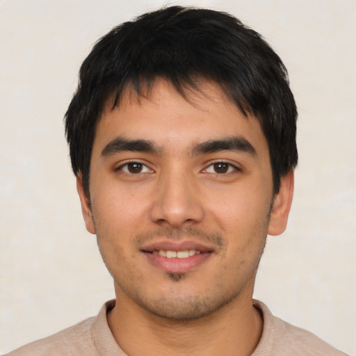 Joyful asian young-adult male with short  black hair and brown eyes