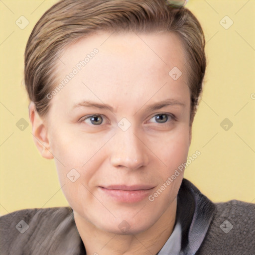 Joyful white young-adult female with short  brown hair and grey eyes