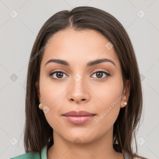 Neutral white young-adult female with long  brown hair and brown eyes