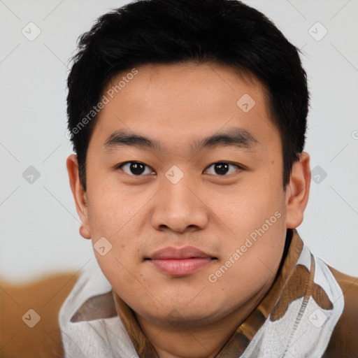 Joyful asian young-adult male with short  brown hair and brown eyes