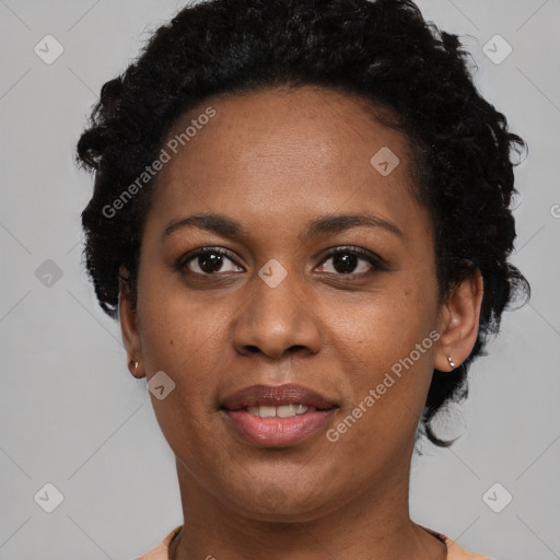 Joyful black young-adult female with short  black hair and brown eyes