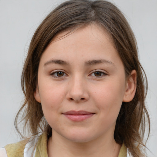 Joyful white child female with medium  brown hair and brown eyes