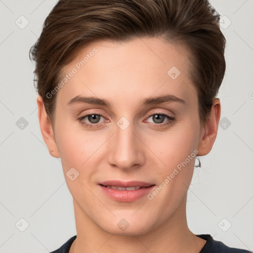 Joyful white young-adult female with short  brown hair and grey eyes