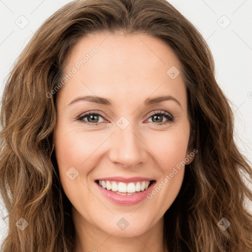 Joyful white young-adult female with long  brown hair and green eyes