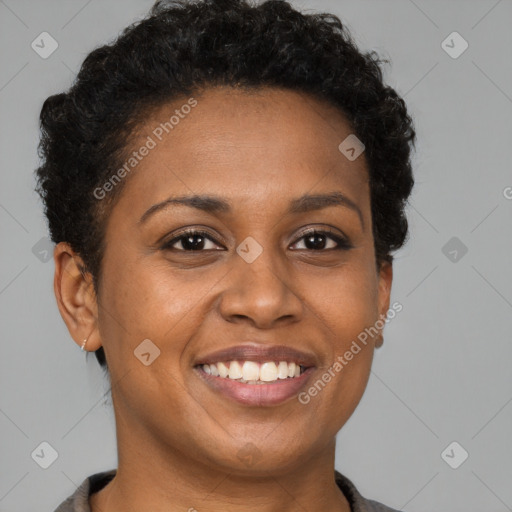 Joyful black young-adult female with short  brown hair and brown eyes