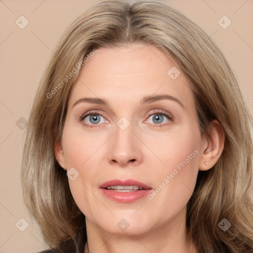 Joyful white adult female with medium  brown hair and blue eyes