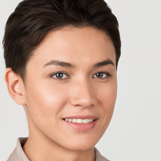 Joyful white young-adult female with short  brown hair and brown eyes