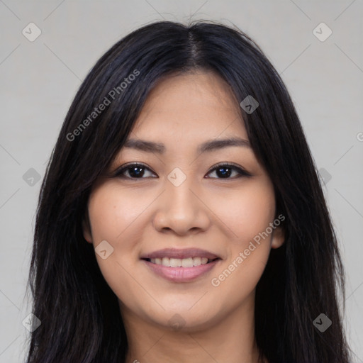 Joyful latino young-adult female with long  black hair and brown eyes