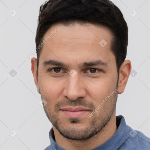 Joyful white young-adult male with short  brown hair and brown eyes