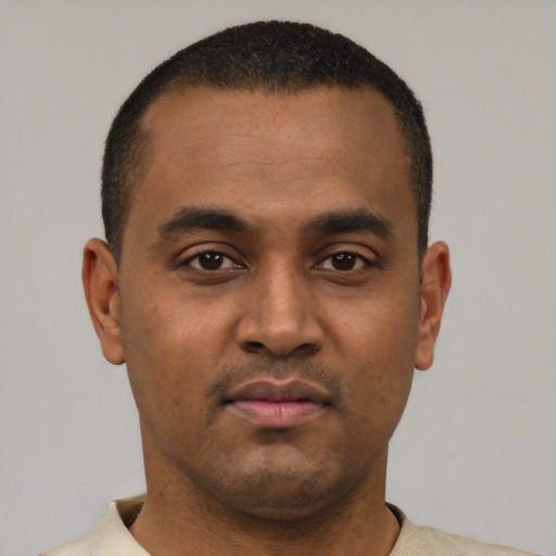 Neutral black young-adult male with short  black hair and brown eyes