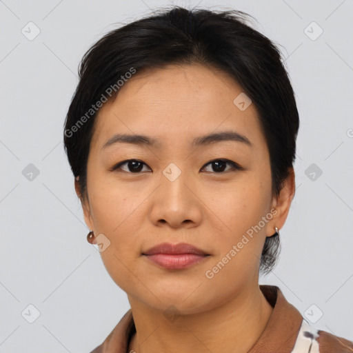 Joyful asian young-adult female with short  brown hair and brown eyes