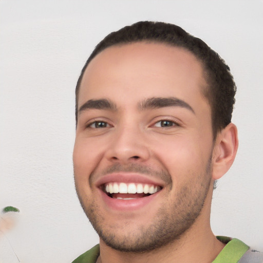 Joyful white young-adult male with short  black hair and brown eyes