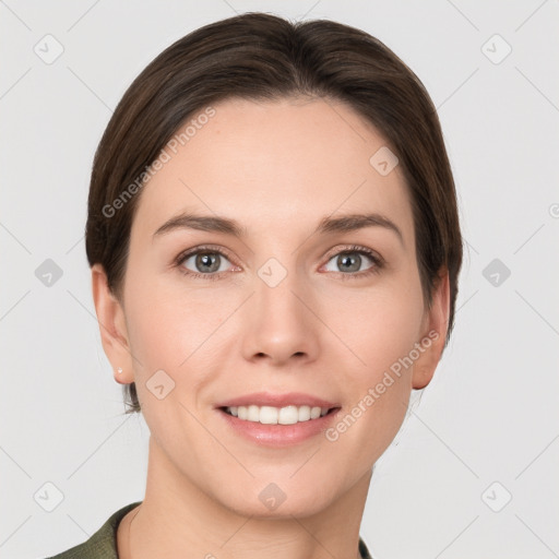 Joyful white young-adult female with short  brown hair and grey eyes