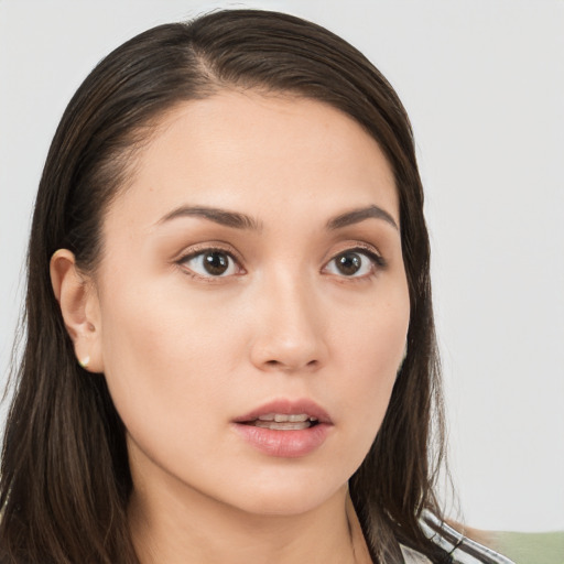 Neutral white young-adult female with long  brown hair and brown eyes