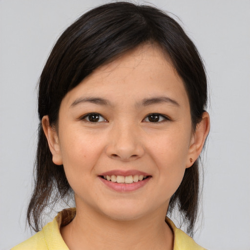 Joyful asian young-adult female with medium  brown hair and brown eyes